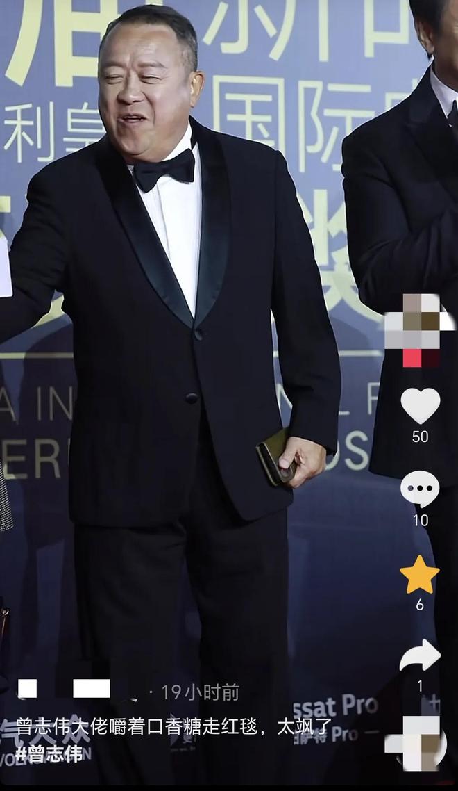 嚼口香糖与金沙总裁骑旋转木马挺幼稚K8凯发曾志伟澳门参加电影节台上(图12)